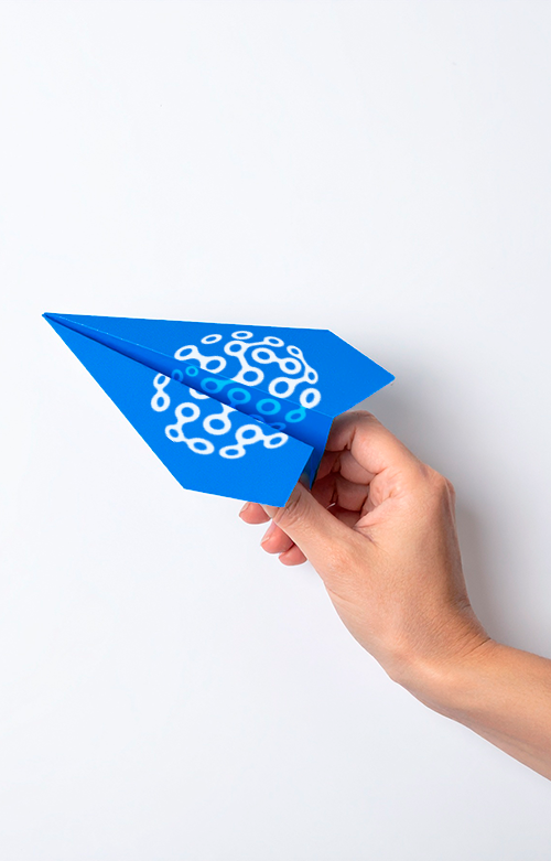 Firefly A photorealistic image of a blue paper airplane being launched into the sky by a human hand_2